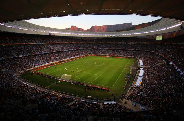 CAPE TOWN, SOUTH AFRICA - JULY 03: A general view of action showing Table Mountain at sunset in the background during the 2010 FIFA World Cup South Africa Quarter Final match between Argentina and Germany at Green Point Stadium on July 3, 2010 in Cape Town, South Africa. (Photo by Clive Rose/Getty Images)