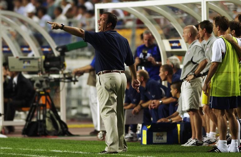 SUWON - JUNE 5: USA soccer coach Bruce Arena encourages his team as they defeat Portugal 3-2 during the second half during the Portugal v USA, Group D, World Cup Group Stage match played at the Suwon World Cup Stadium, Suwon, South Korea on June 5, 2002. USA won the match 3 - 2. (Photo by Shaun Botterill/Getty Images)