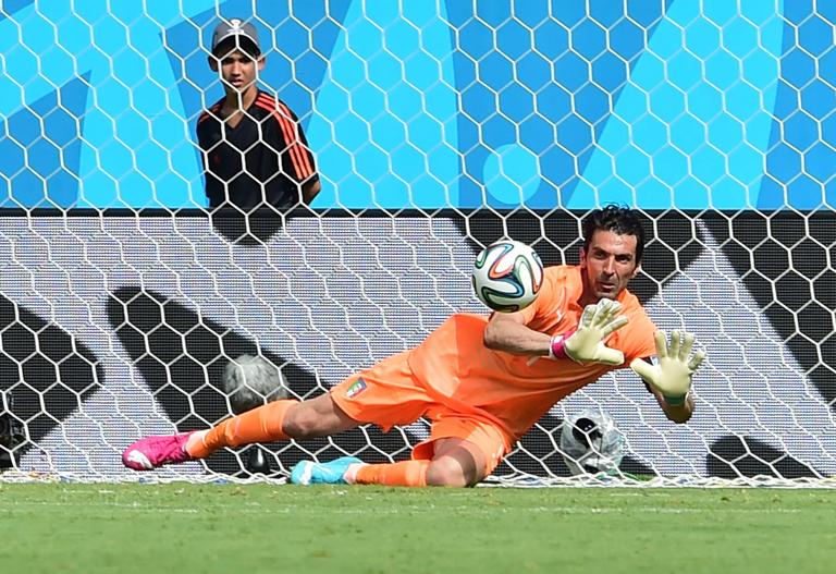 Italy's goalkeeper Gianluigi Buffon dives for the ball during a Group D football match between Italy and Costa Rica at the Pernambuco Arena in Recife during the 2014 FIFA World Cup on June 20, 2014. AFP PHOTO / GIUSEPPE CACACE (Photo credit should read GIUSEPPE CACACE/AFP via Getty Images)