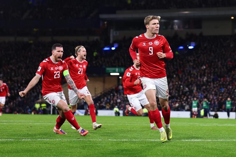 GLASGOW, SCOTLAND - NOVEMBER 18: Rasmus Hojlund of Denmark celebrates after scoring a goal to make it 1-1 during the FIFA World Cup 2026 qualifier match between Scotland and Denmark at Hampden Park on November 18, 2025 in Glasgow, Scotland. (Photo by Robbie Jay Barratt - AMA/Getty Images)