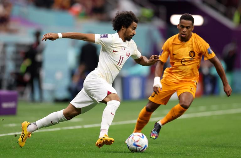 AL KHOR, QATAR - NOVEMBER 29: Akram Afif of Qatar controls the ball against Jurrien Timber of Netherlands during the FIFA World Cup Qatar 2022 Group A match between Netherlands and Qatar at Al Bayt Stadium on November 29, 2022 in Al Khor, Qatar. (Photo by Catherine Ivill/Getty Images)