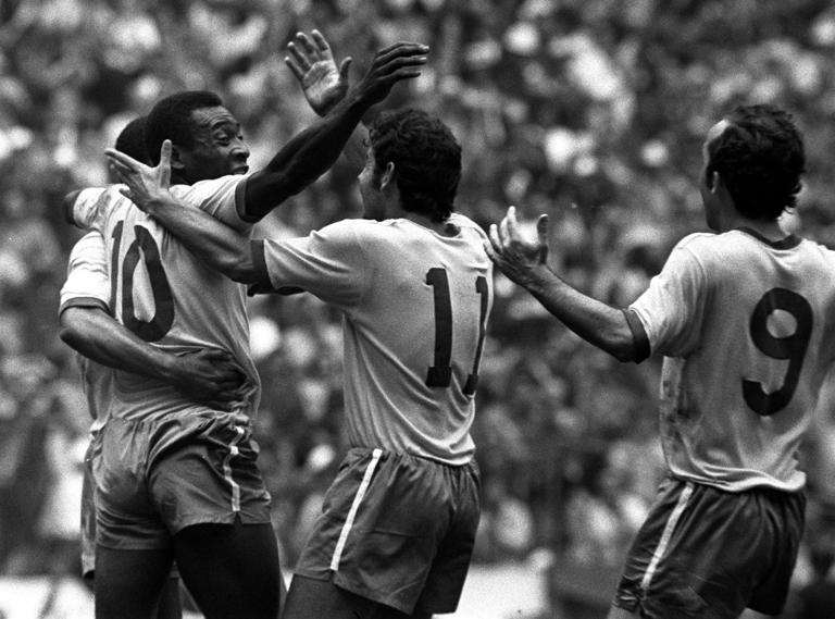 Sport, Football, World Cup Final, Mexico City, Mexico, 21st June 1970, Brazil 4 v Italy 1, Brazil's Pele (10) is hugged by Rivellino (11) after he had scored the first goal  (Photo by Popperfoto via Getty Images)
