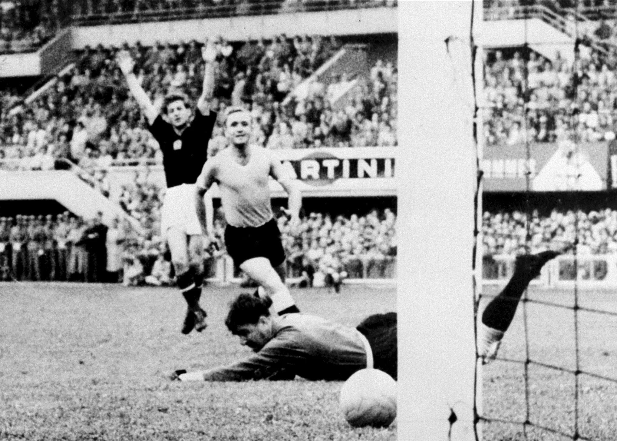 Sandor Kocsis celebrates as Hungary team-mate Zoltan Czibor`s shot rolls into the net in their 1954 FIFA World Cup Switzerland semi-final with Uruguay Hungarian forward Sandor Kocsis (L) celebrates as the ball rolls past Uruguayan goalkeeper Gaston Roque Maspoli into the net for a goal as defender Jose Santamaria looks on 30 June 1954 in Lausanne during the World Cup semifinal match between Hungary and Uruguay. Hungary advanced to the final with a 4-2 victory in extra time. AFP PHOTO (Photo credit should read STAFF/AFP via Getty Images)